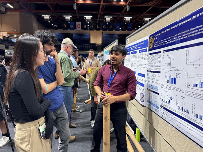 Aman Singla presenting his research at the 2024 Undergraduate Research, Scholarship and Creative Activities Conference. 